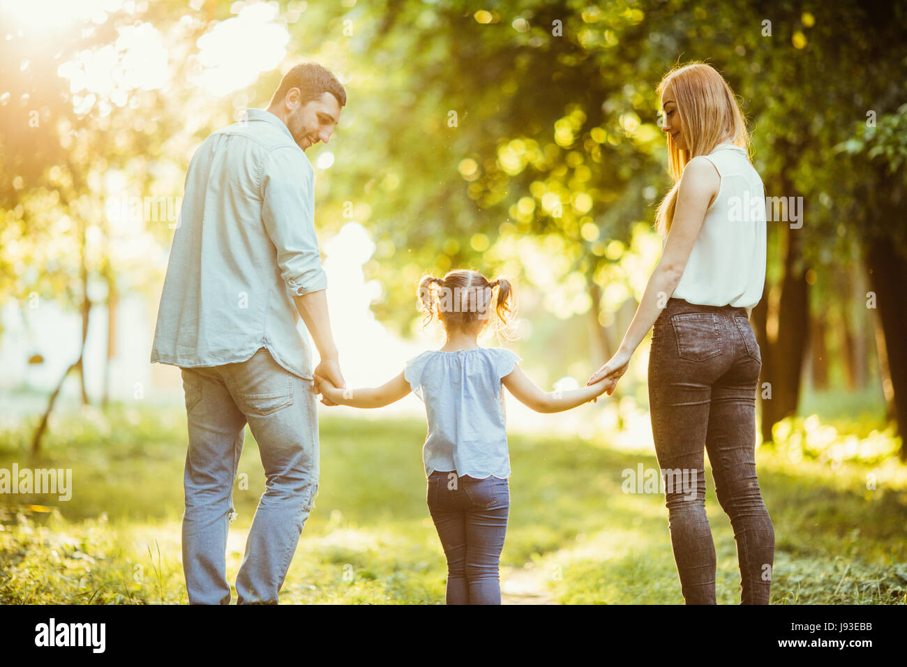 happy family walking outdoors in summer park Stock Photo - Alamy