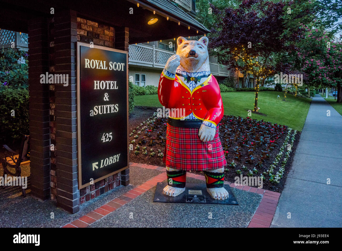 Welcoming spirit bear wearing a kilt, Royal Scot Hotel, Victoria, British Columbia, Canada Stock Photo