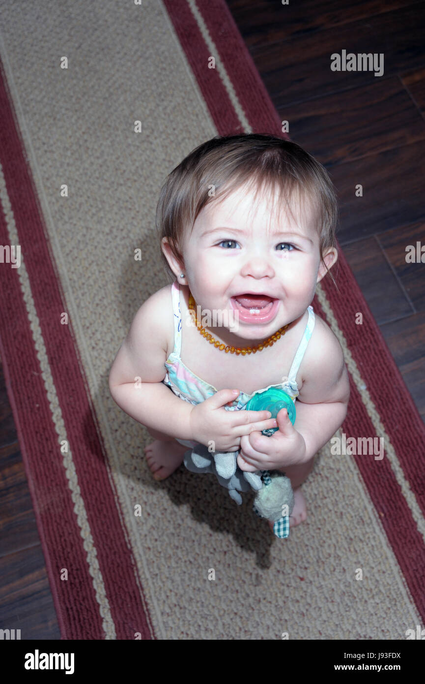 Little Girl Learning to Walk Stock Photo