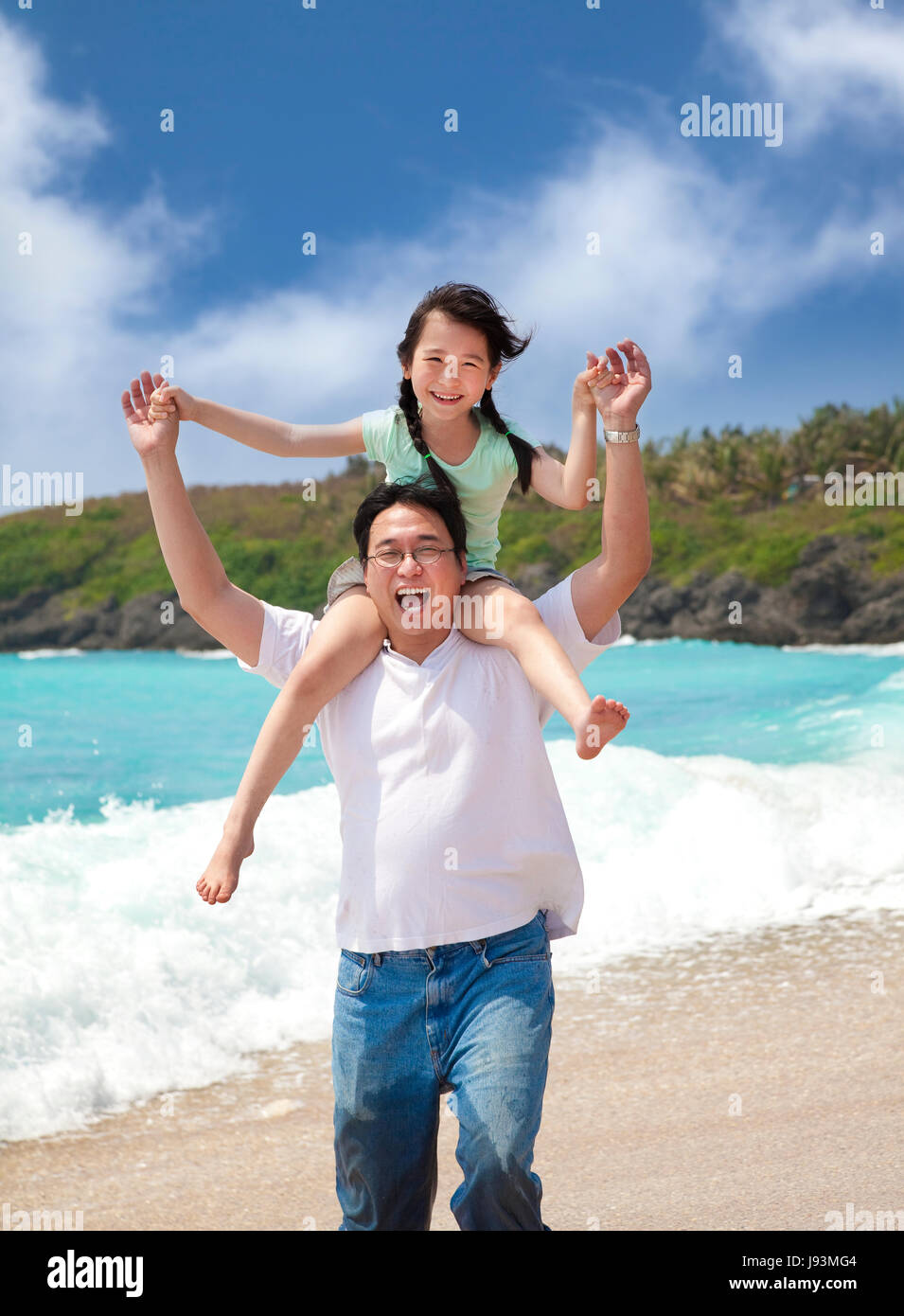 Happy asian family playing at the beach hi-res stock photography and ...