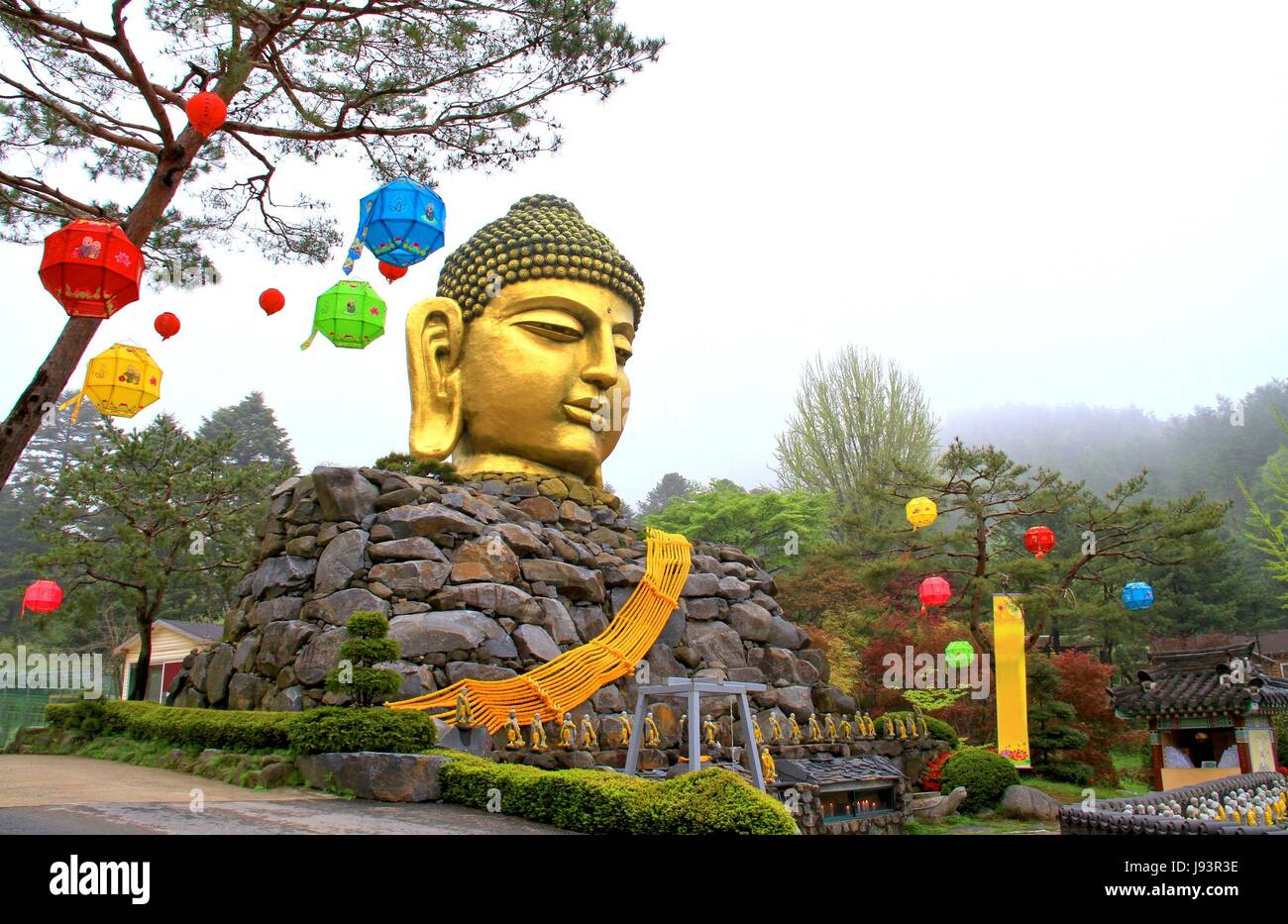 Golden head big Buddha statue with body made from stones, The Yunwha