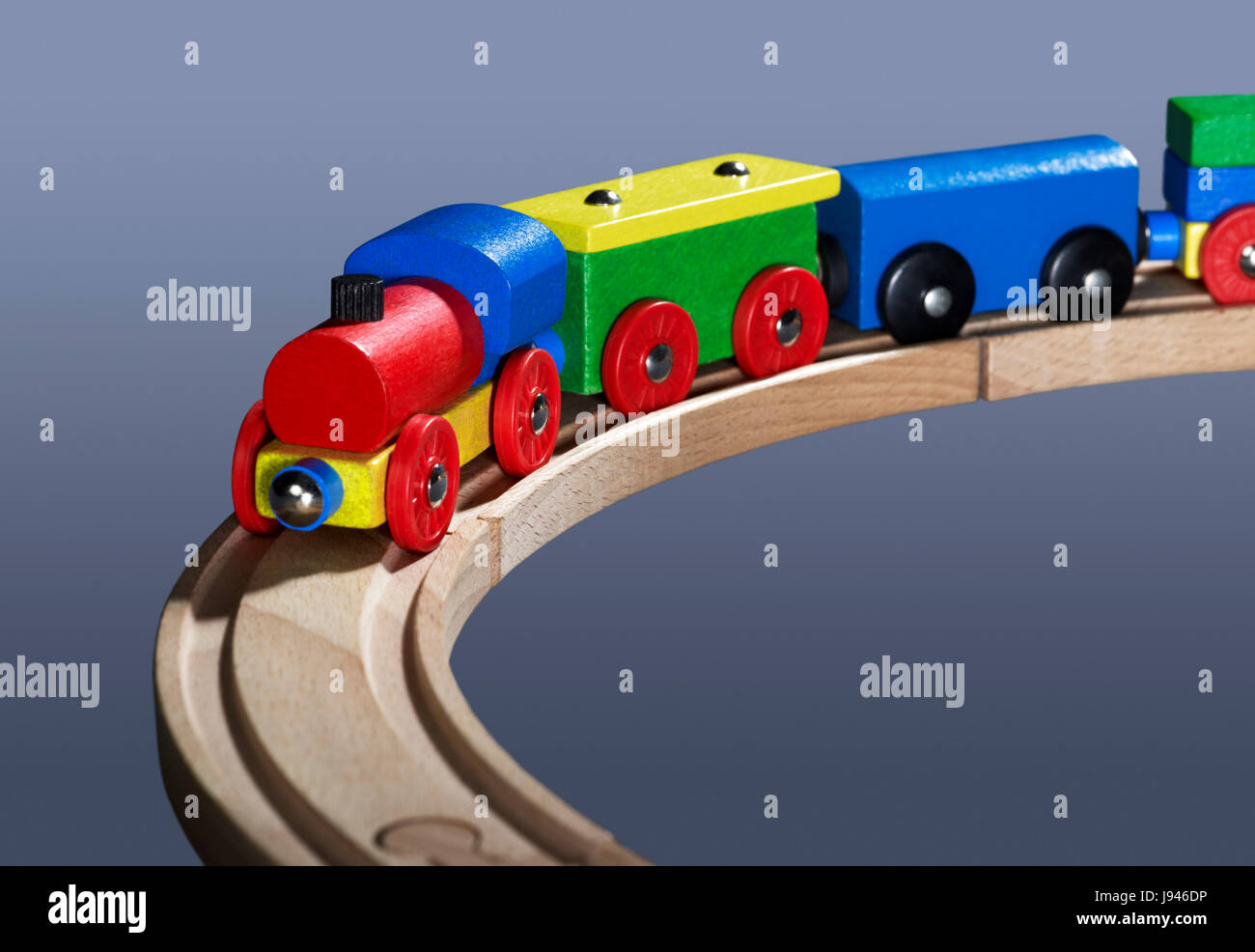 colorful wooden toy train on tracks Stock Photo Alamy