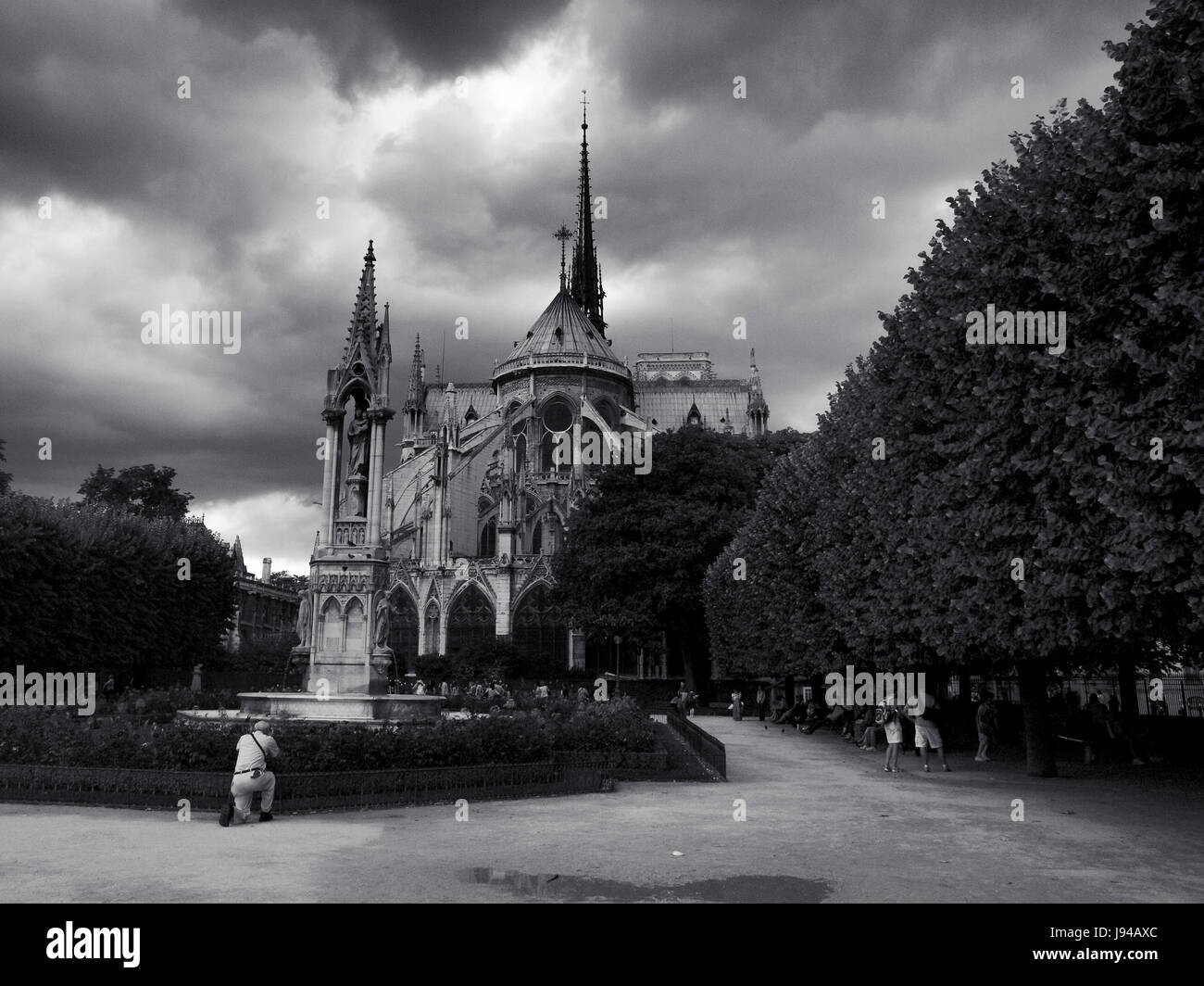 A photographer takes a picture of the Notre, Dame, In Paris, France