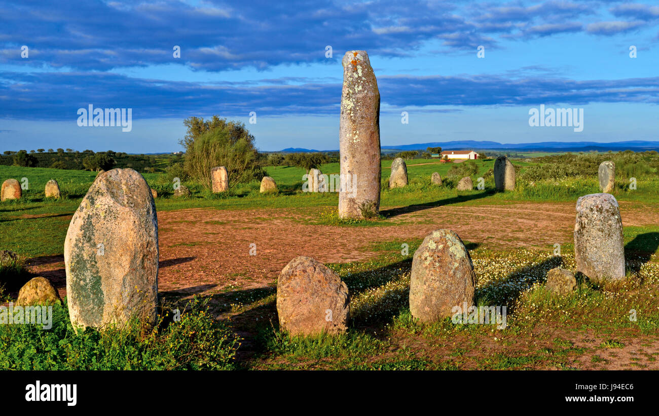 Megalithic stone circle “Cromeleque do Xerez”  near Monsaraz with small stones and 3 m high menhir in the middle Stock Photo
