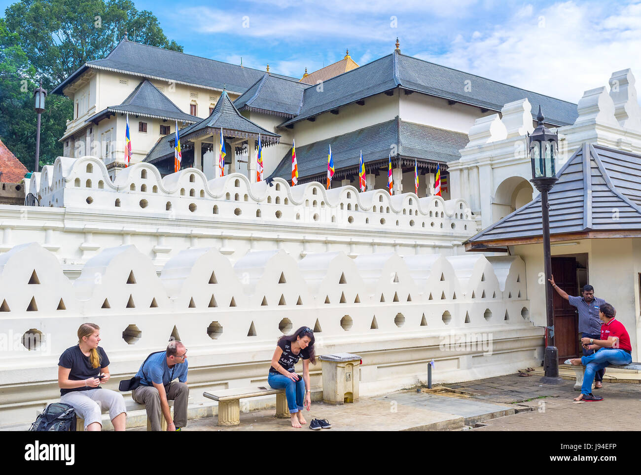 KANDY, SRI LANKA - NOVEMBER 28, 2016: Tourists take off their shoes