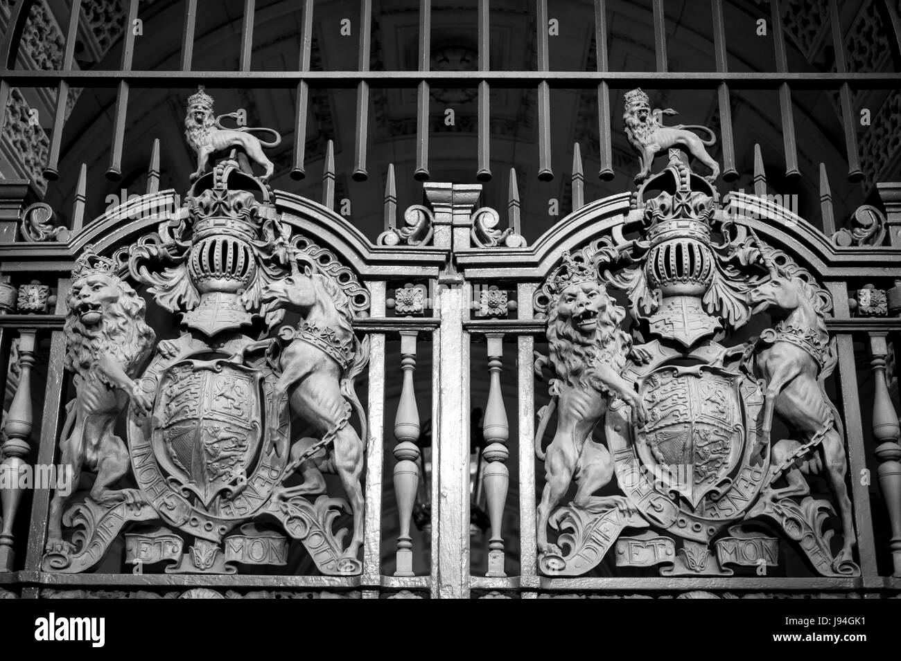 Close-up of the royal coat of arms of the United Kingdom on a closed gated entrance to an official building in Whitehall, in London, England Stock Photo