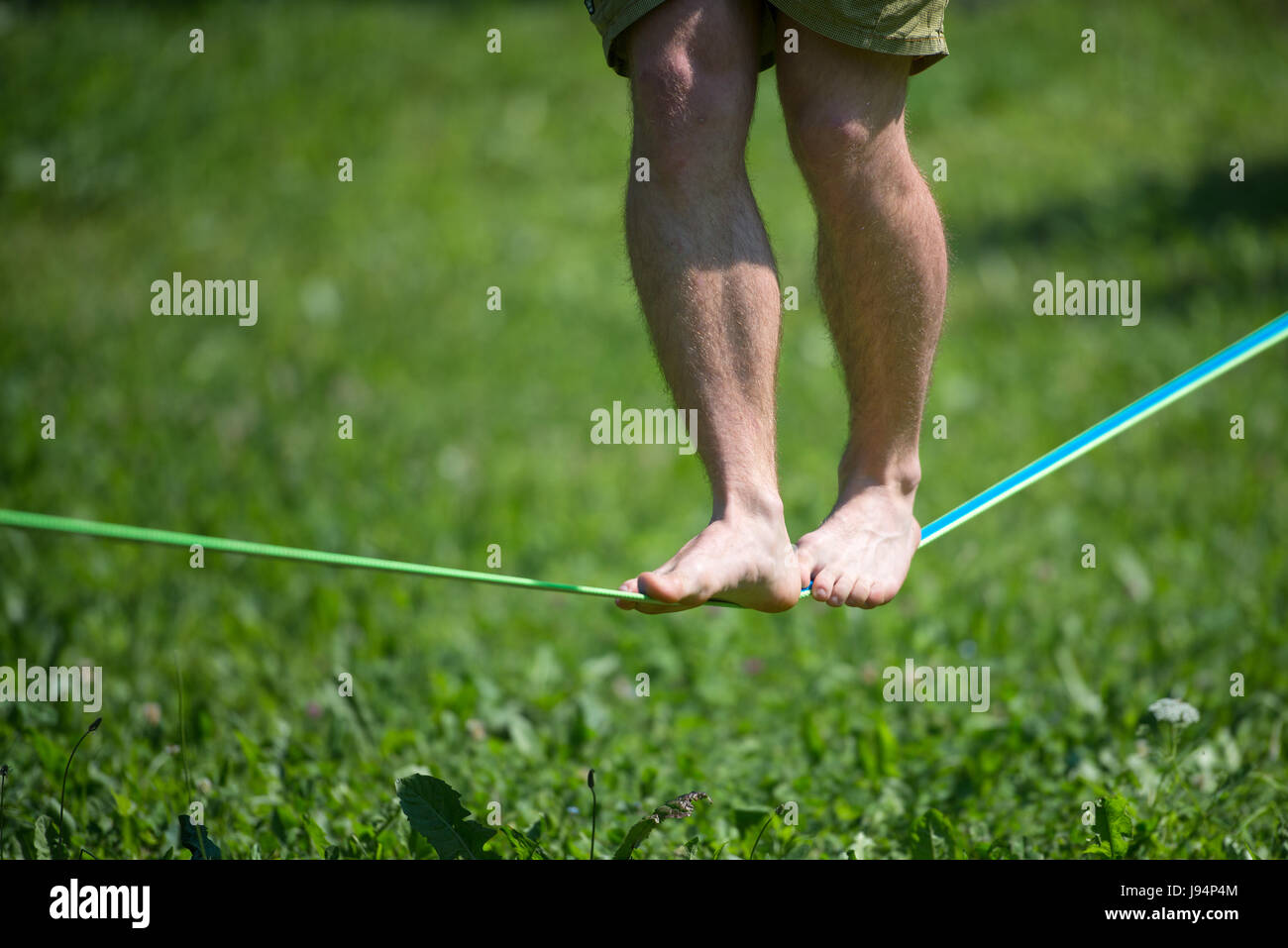 Walk in balance on rope barefoot in the park Stock Photo Alamy