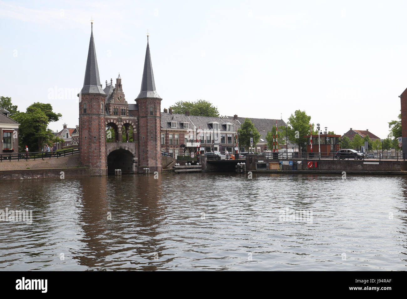 The Waterpoort or water gate is a landmark in Sneek, the Netherlands. A defensive wall that connects a city to a waterway. Stock Photo