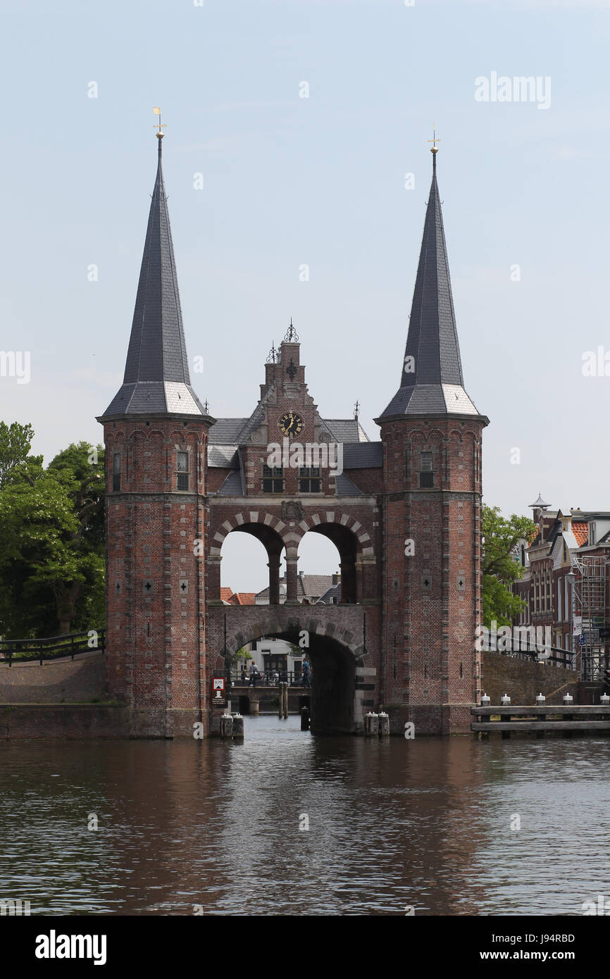 The Waterpoort or water gate is a landmark in Sneek, the Netherlands. A defensive wall that connects a city to a waterway. Stock Photo