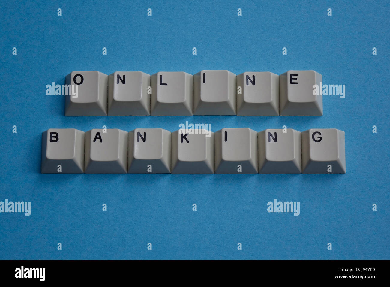ILLUSTRATION - The phrase 'ONLINE BANKING' is spelt out with letters taken from a computer keyboard. Taken 19.02.2017. Online banking is an overarching term that applies to carrying out banking transactions independently of physical bank branches and their opening times. Online banking, electronic banking or home banking are data transfer processes or transactions carried out with the help of PCs, smartphones and other terminal devices, or over telephones or fax devices (telebanking, telephone banking). In 2014, already 55 per cent of Germans took care of their bank transactions online. - NO W Stock Photo