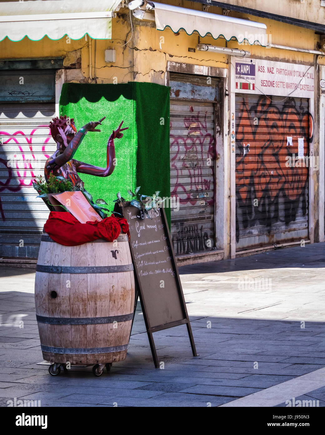 Venice,Italy. Menu of Typical coffee bar,restaurant,cafe with painted mannequin in Via Garribaldi Stock Photo