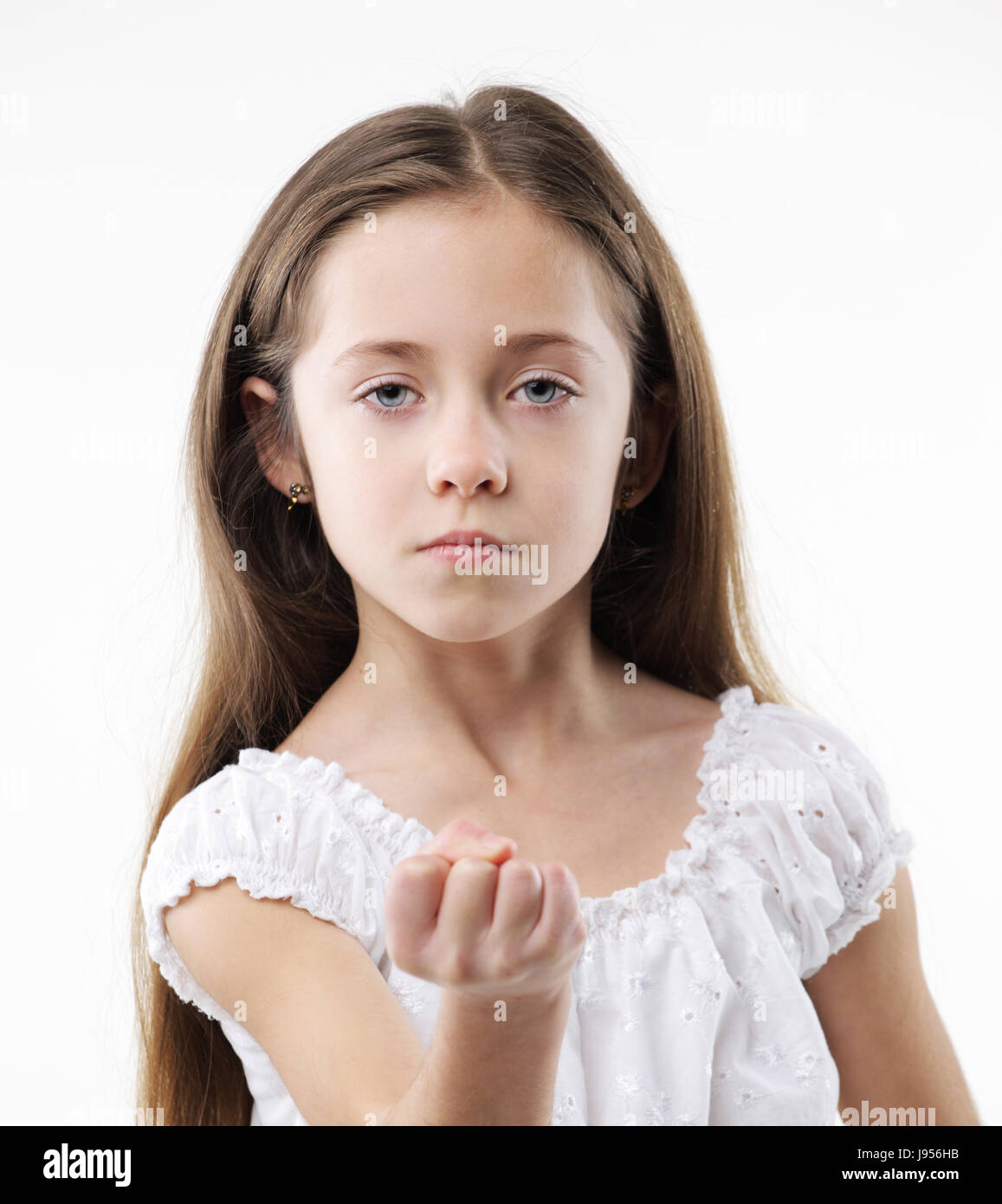 An angry young girl showing fist on white background Stock Photo Alamy