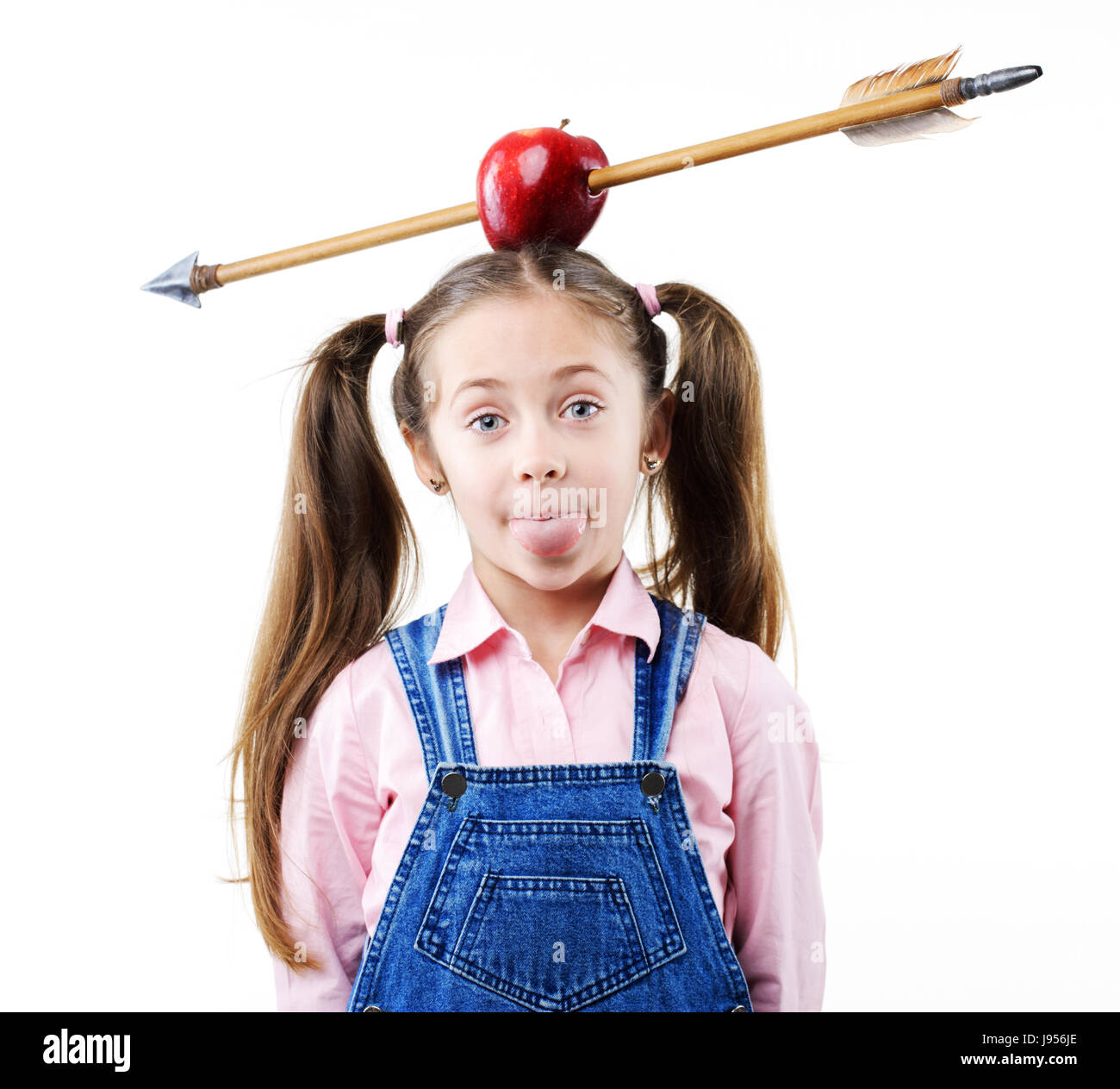 Little girl with apple on his head with arrow shot through Stock Photo