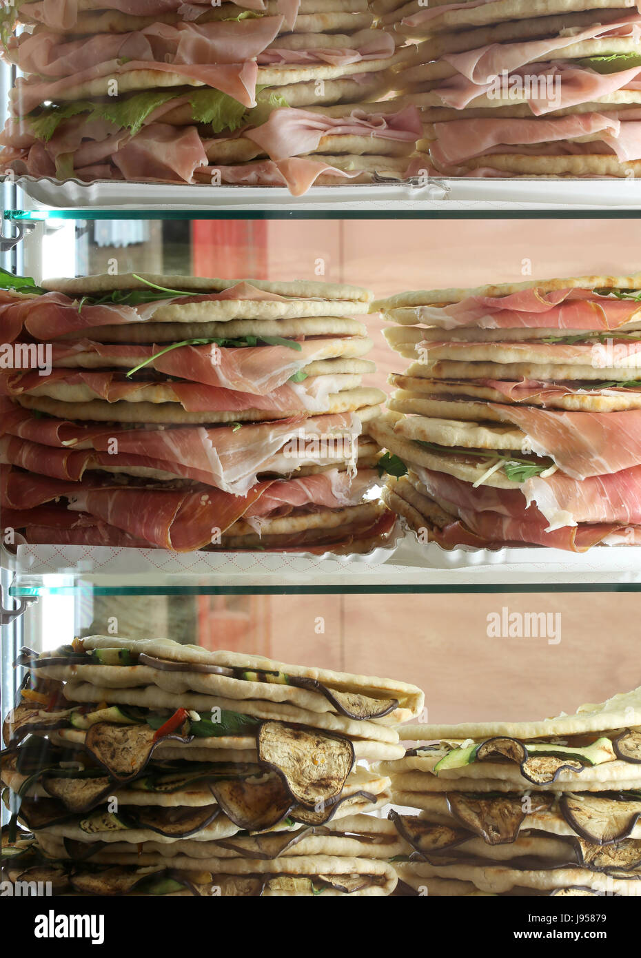 Refrigerator with lots of stuffed sandwiches called Spianata or Piadina