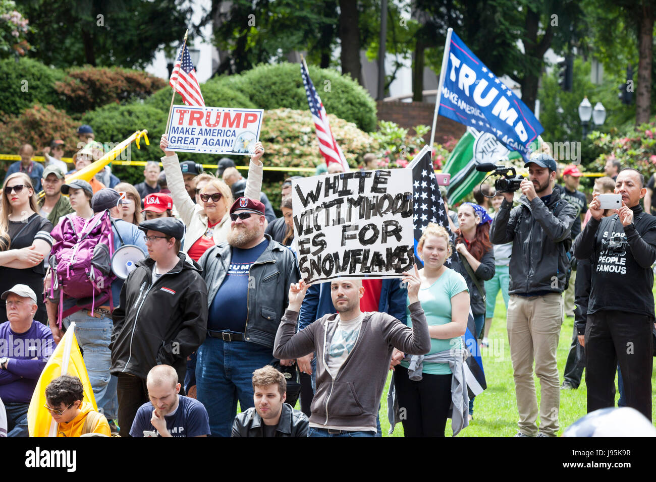 Portland, United States. 04th June, 2017. Portland, Oregon: Supporters at the Trump Free Speech Rally Portland. Organized by Joey Gibson, a leader of the Patriot Prayer group, the rally in downtown Portland featured right-wing nationalist Kyle Chapman and speakers in support of free speech and President Trump. Credit: Paul Gordon/Alamy Live News Stock Photo