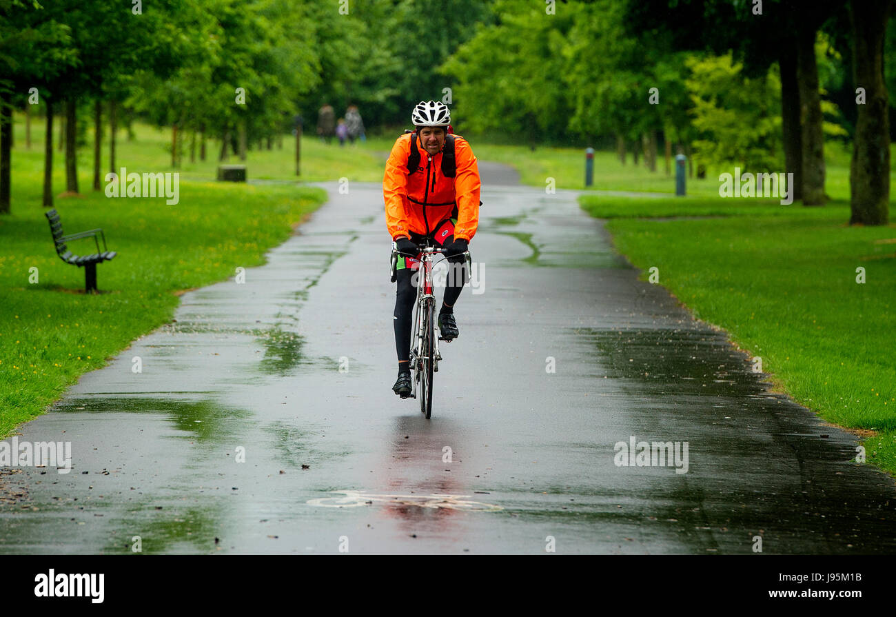 Bolton, Lancashire, UK. 05th June, 2017. Very soggy cycle to work in Leverhulme Park, Bolton, Lancashire, UK. Torrential rain lashes the North West of England at the start of June. Picture by Paul Heyes, Monday June 05, 2017. Credit: Paul Heyes/Alamy Live News Stock Photo