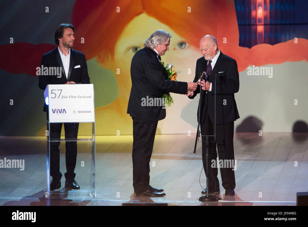 Zlin, Czech Republic. 02nd June, 2017. Czech artist and costume designer Theodor Pistek, 84, right, Oscar winner for his costumes in Milos Forman's film Amadeus (1984), received the Golden Slipper for outstanding contribution to cinematography for children and youth at the 57th International Film Festival for Children and Youth in Zlin, Czech Republic, June 2, 2017. From left: Czech moderator Roman Vojtek and Festival's President Cestmir Vancura. Credit: Josef Omelka/CTK Photo/Alamy Live News Stock Photo