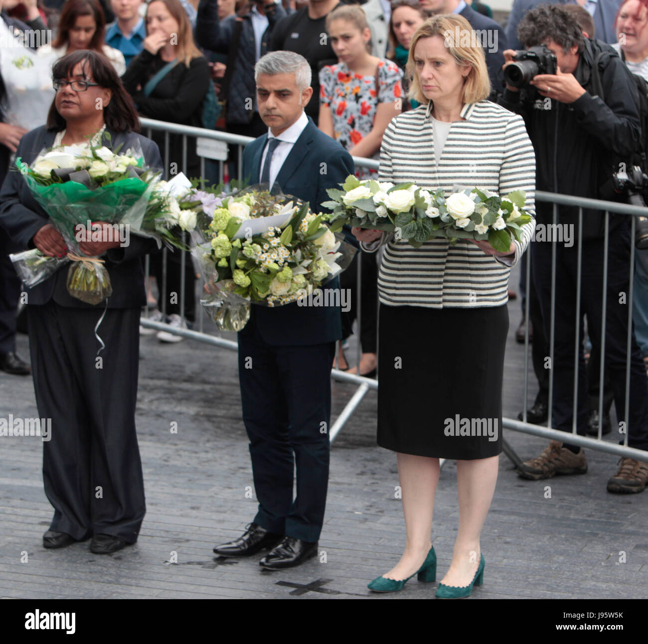 London, UK. 05th June, 2017. A vigil took place by Potters Field to remember those who died in the terror attack of Saturday in Borough High Street, floral tributes were lay by Amber Rudd home secretary, Diana Abbott MP for Hackney and Sadi Khan  Credit: Paul Quezada-Neiman/Alamy Live News Stock Photo