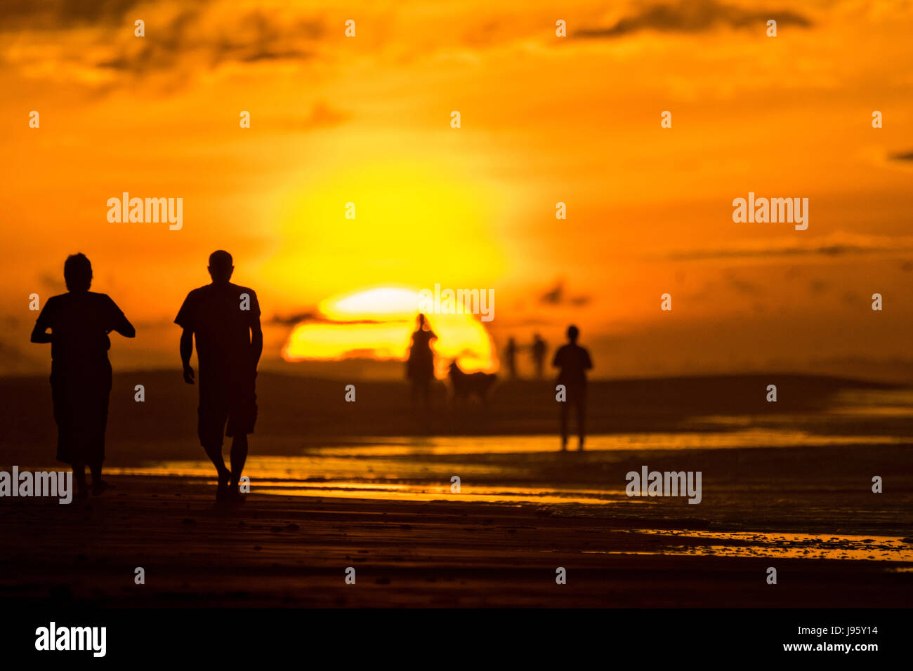 South Carolina, USA. 5th Jun, 2017. People gather along the beach to watch the sunrise on a cloudy morning June 5, 2017 in Folly Beach, South Carolina. Folly Beach is a quirky beach community outside Charleston known to locals as the Edge of America. Credit: Planetpix/Alamy Live News Stock Photo