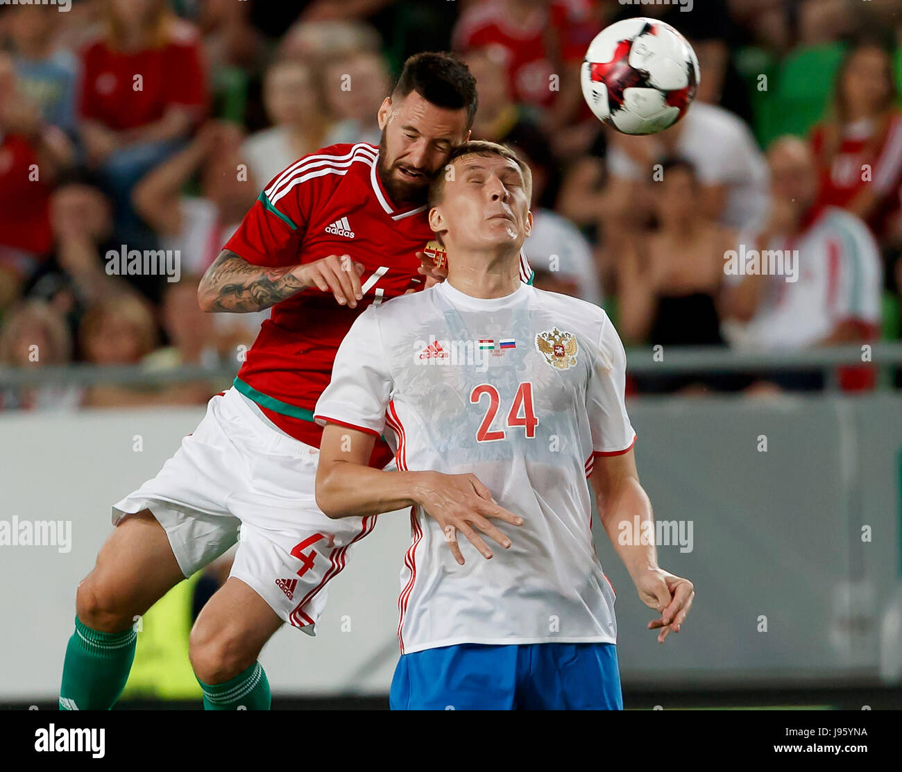 Budapest, Hungary. 05th June, 2017. BUDAPEST, HUNGARY - JUNE 5: Tamas Kadar #4 of Hungary competes for the ball in the air with Aleksandr Bukharov #24 of Russia during the International Friendly match between Hungary and Russia at Groupama Arena on June 5, 2017 in Budapest, Hungary. Credit: Laszlo Szirtesi/Alamy Live News Stock Photo
