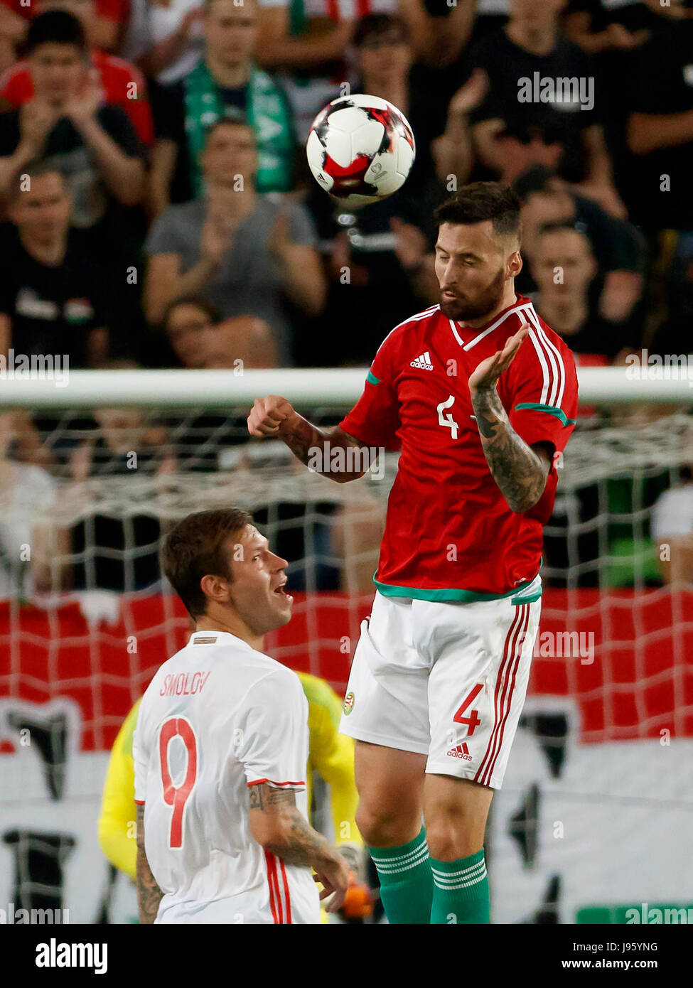 Budapest, Hungary. 05th June, 2017. BUDAPEST, HUNGARY - JUNE 5: Tamas Kadar #4 of Hungary wins the ball in the air from Fedor Smolov #9 of Russia during the International Friendly match between Hungary and Russia at Groupama Arena on June 5, 2017 in Budapest, Hungary. Credit: Laszlo Szirtesi/Alamy Live News Stock Photo