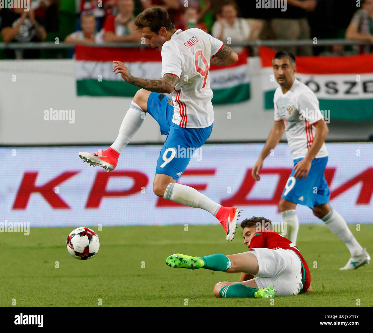 Budapest, Hungary. 05th June, 2017. BUDAPEST, HUNGARY - JUNE 5: Roland Sallai (L2) of Hungary slide tackles Fedor Smolov #9 of Russia in front of Aleksandr Samedov (R) of Russia during the International Friendly match between Hungary and Russia at Groupama Arena on June 5, 2017 in Budapest, Hungary. Credit: Laszlo Szirtesi/Alamy Live News Stock Photo