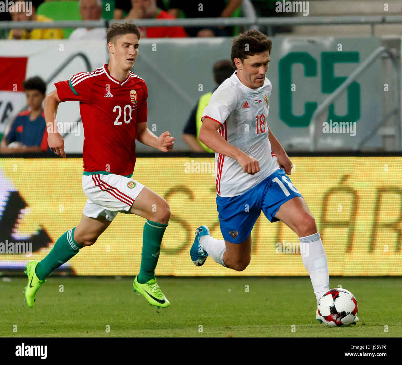 Budapest, Hungary. 05th June, 2017. BUDAPEST, HUNGARY - JUNE 5: Yuri Zhirkov #18 of Russia leaves Roland Sallai #20 of Hungary behind during the International Friendly match between Hungary and Russia at Groupama Arena on June 5, 2017 in Budapest, Hungary. Credit: Laszlo Szirtesi/Alamy Live News Stock Photo