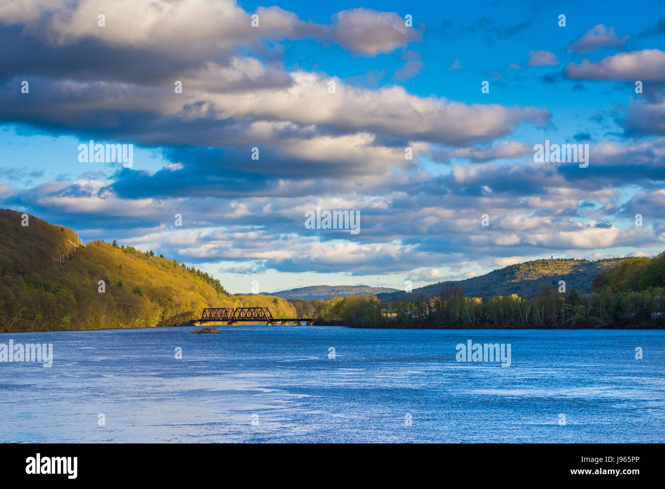 Mountains and railroad bridge over the Connecticut River, in Brattleboro, Vermont. Stock Photo