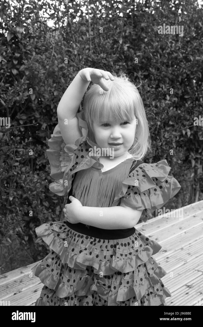 Little girl, child in a spanish dancer pose wearing a spanish dancer