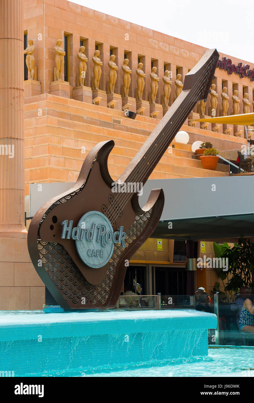 The huge replica electric guitar structure in the water feature at the entrance to the Hard Rock Cafe in Playa Las Americas in Teneriffe Stock Photo