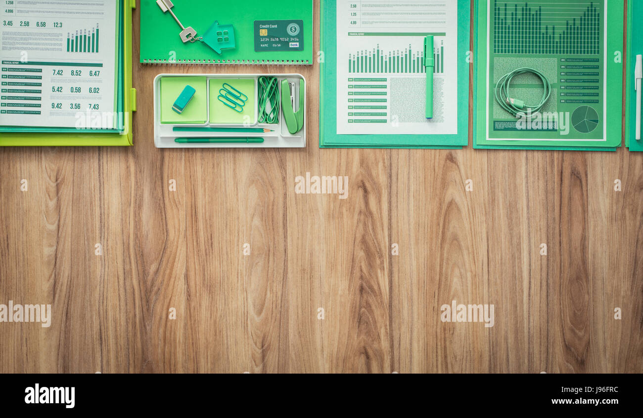Green Office Supplies Stationery And Financial Reports On A