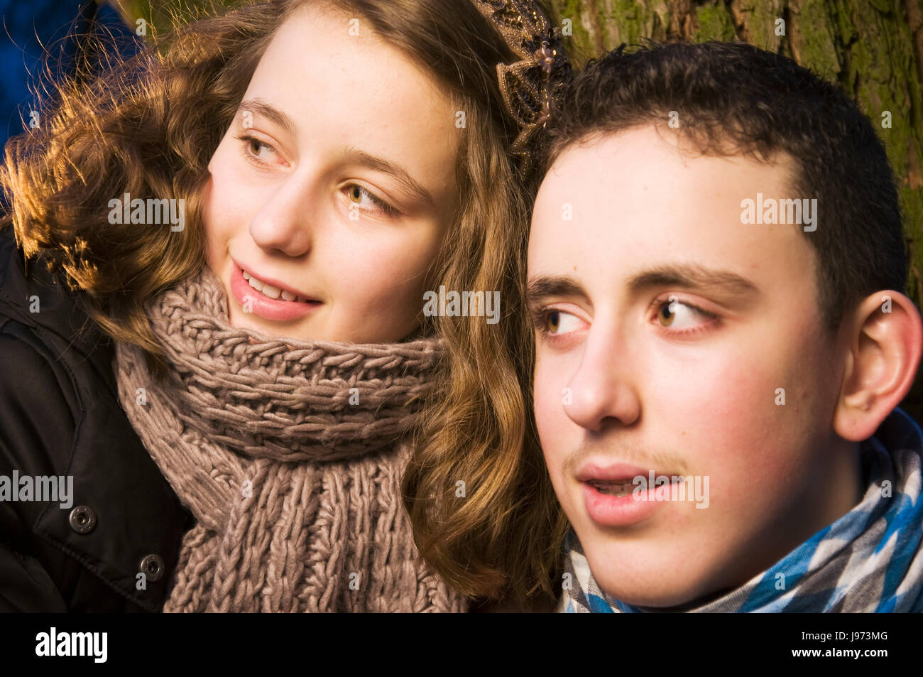 girl and boy look to the side Stock Photo Alamy