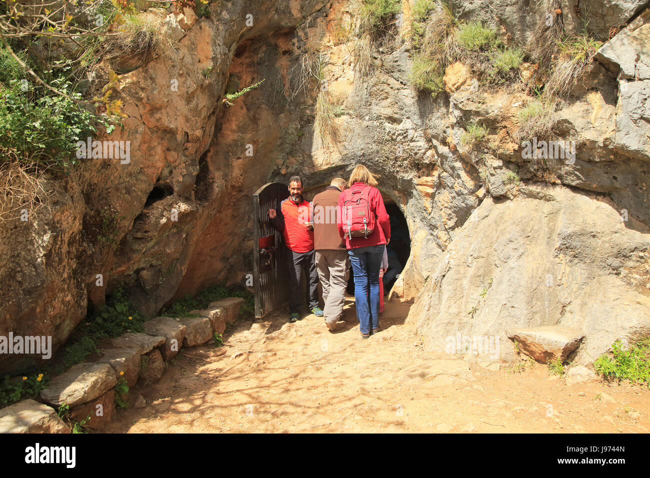 People entering the cave entrance, Cueva de la Pileta, near Ronda