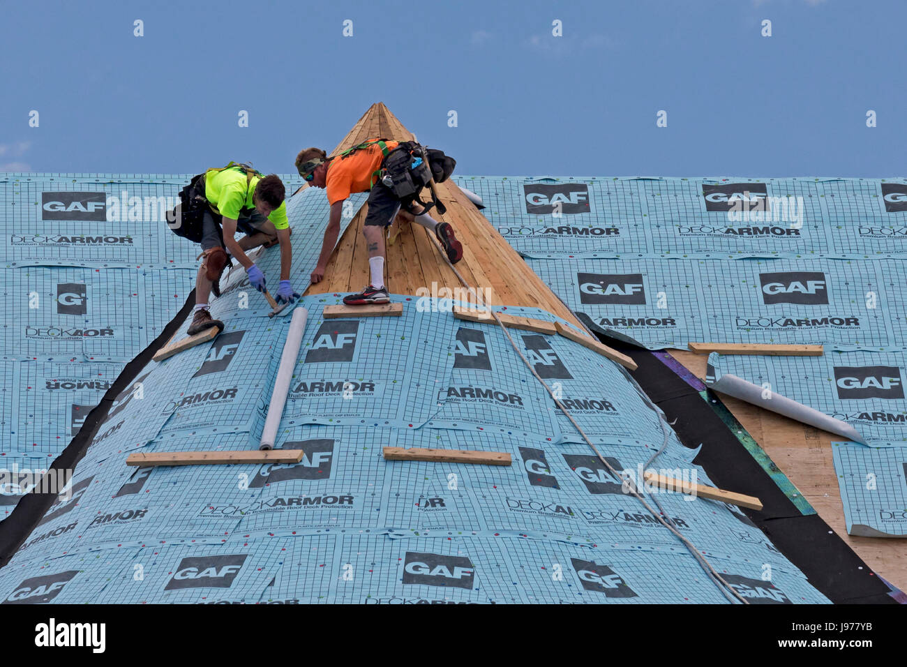 Grosse Pointe Park, Michigan Workers install synthetic roofing felt