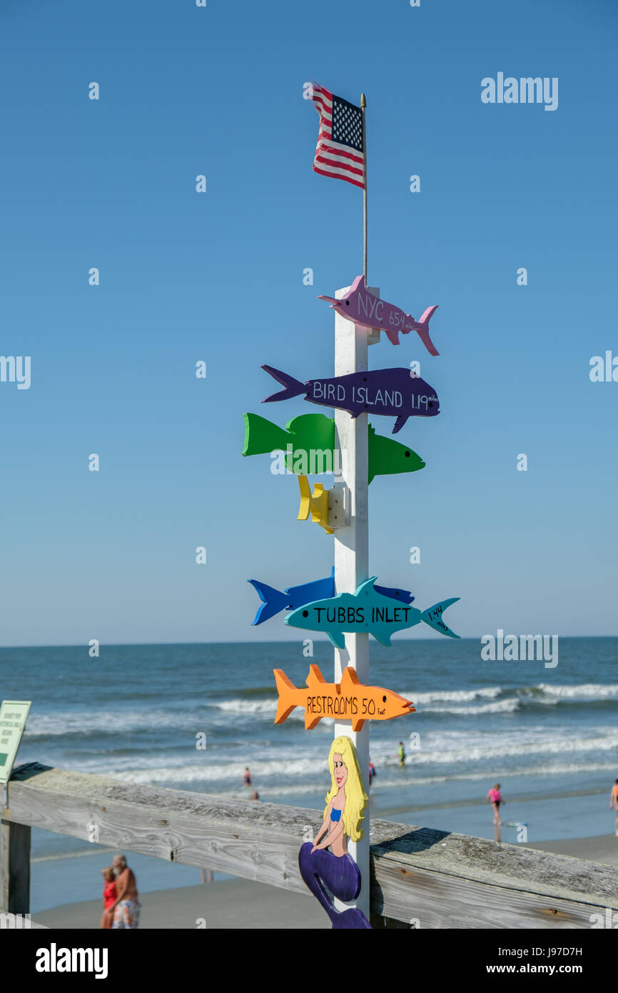 Fish guide post with directions, Sunset Beach, NC Stock Photo