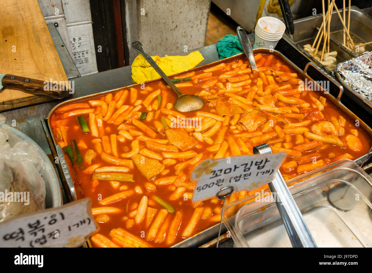 Tteokbokki - Popular Korean fast food made from finger sized rice cake cooked in chilly sauce called gochujang, South Korea Stock Photo