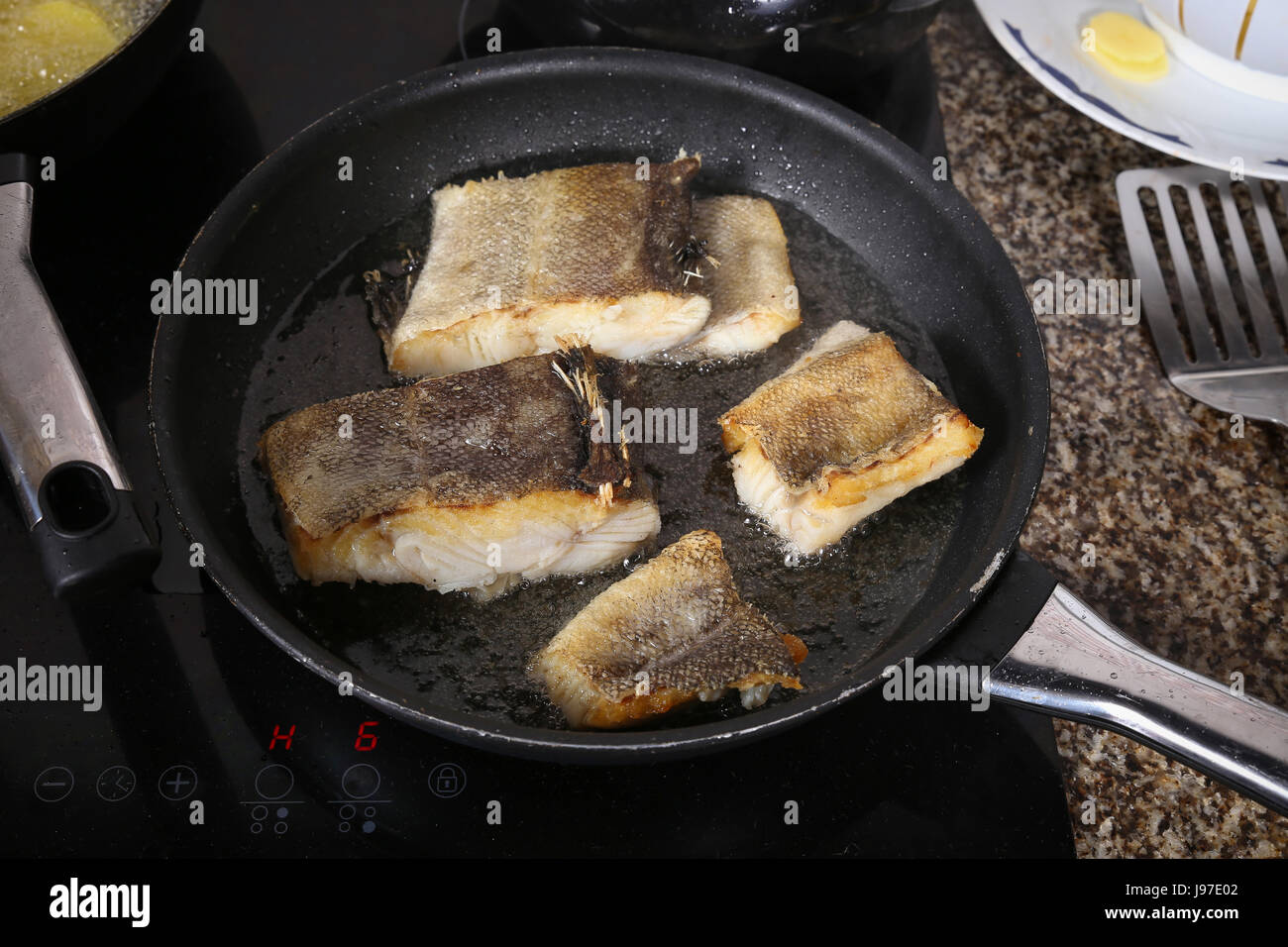 Cook fish in the pan Stock Photo Alamy