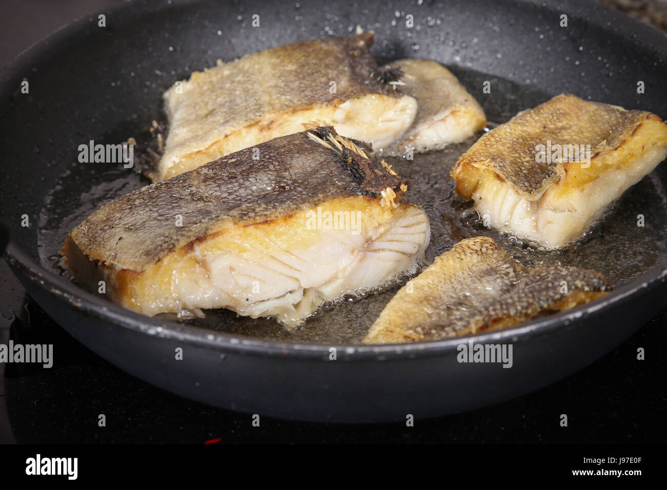 Cook fish in the pan Stock Photo Alamy