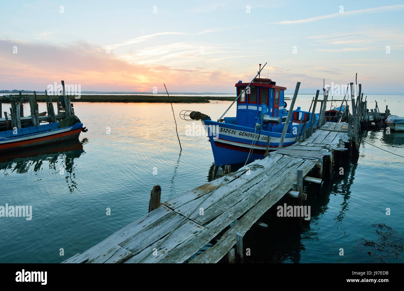 A fishing harbour on stilts. Carrasqueira at dusk. Alentejo, Portugal Stock Photo