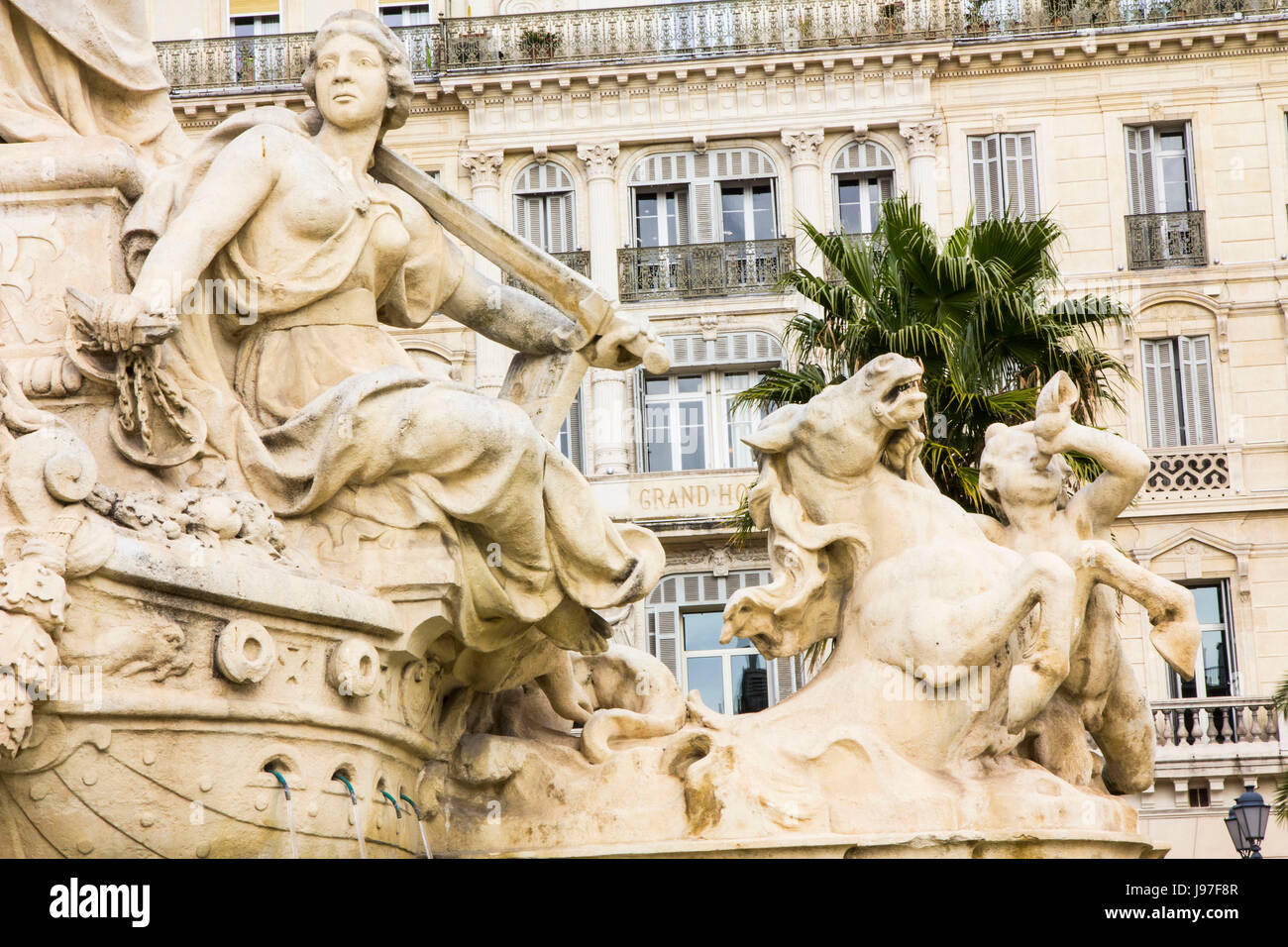 Sandstone mythological figures on cascading fountain, city center, Toulon, France, Europe. Stock Photo