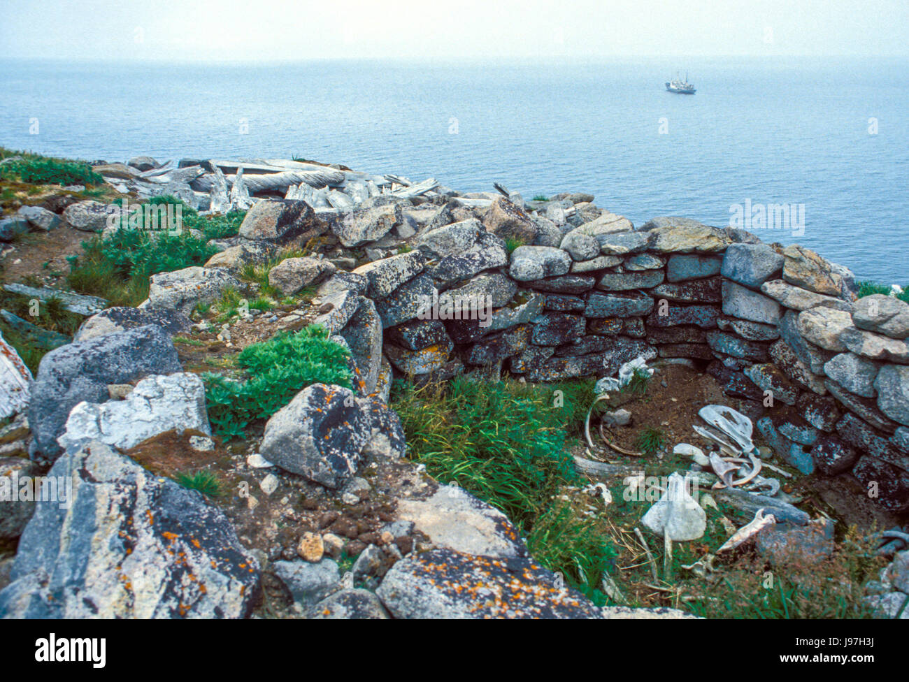 Ancient pit house ruins at Cape Dezhnev, Russian Far East, the furthest east of Eurasia. Stock Photo
