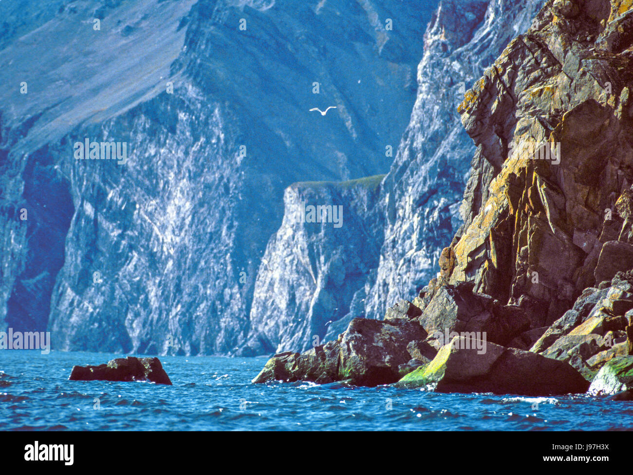 Rugged cliffs along the coast of the Chukotka (Chukchi) Peninsula in the Russian Far East. Stock Photo