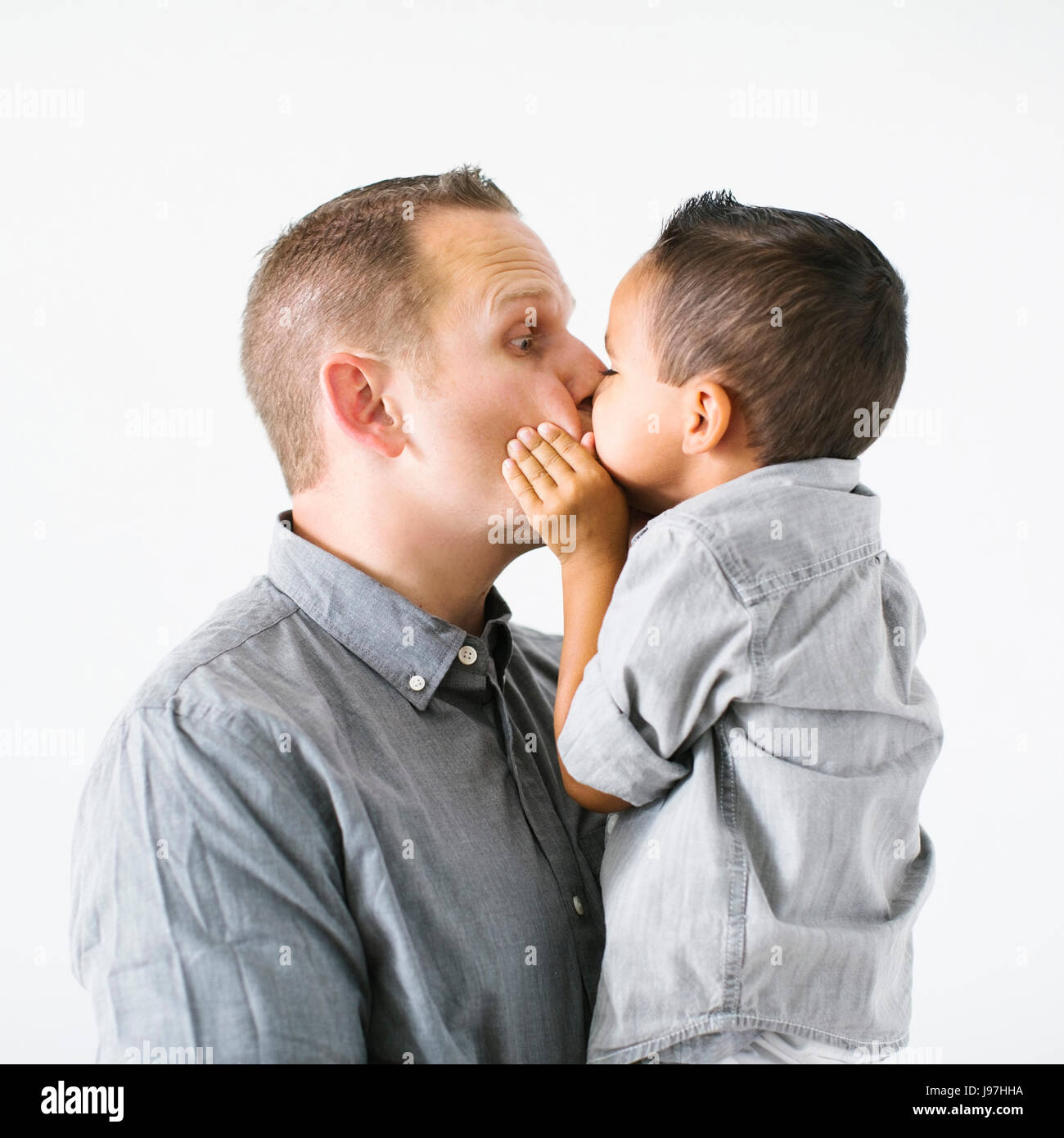 Father kissing son (2-3) Stock Photo