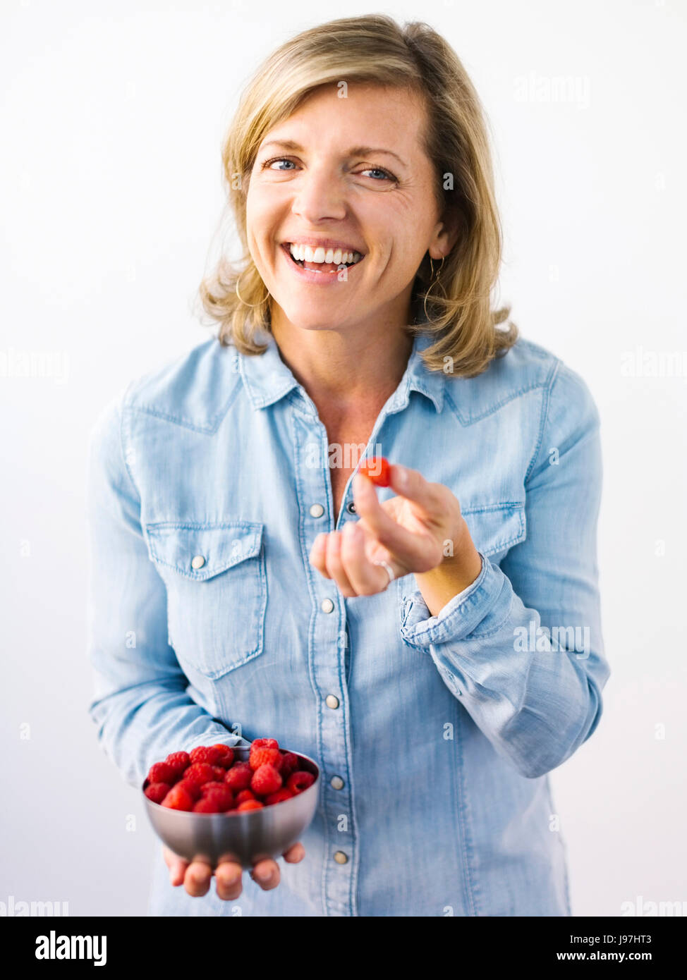 Woman holding bowl hi-res stock photography and images - Alamy