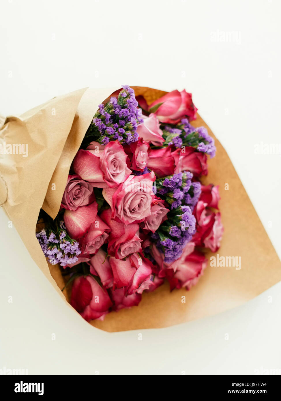 Rose bouquets wrapped in tissue paper - Stock Image - C053/7583