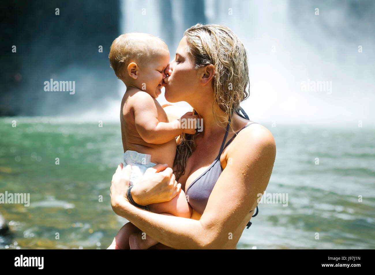 Mother kissing baby (18-23 months) with love Stock Photo