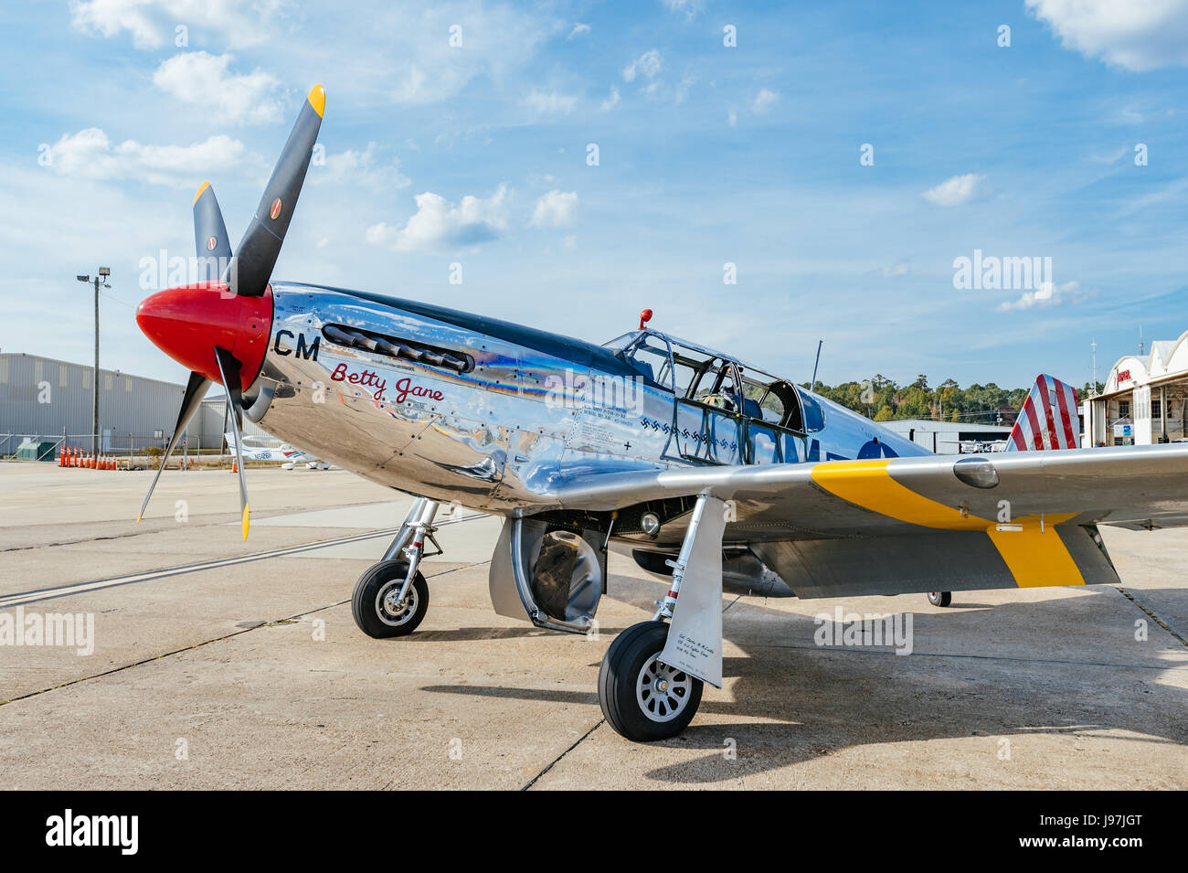 Parked vintage American P 51 Mustang fighter airplane, the Betty Jane, from WWII era. Stock Photo