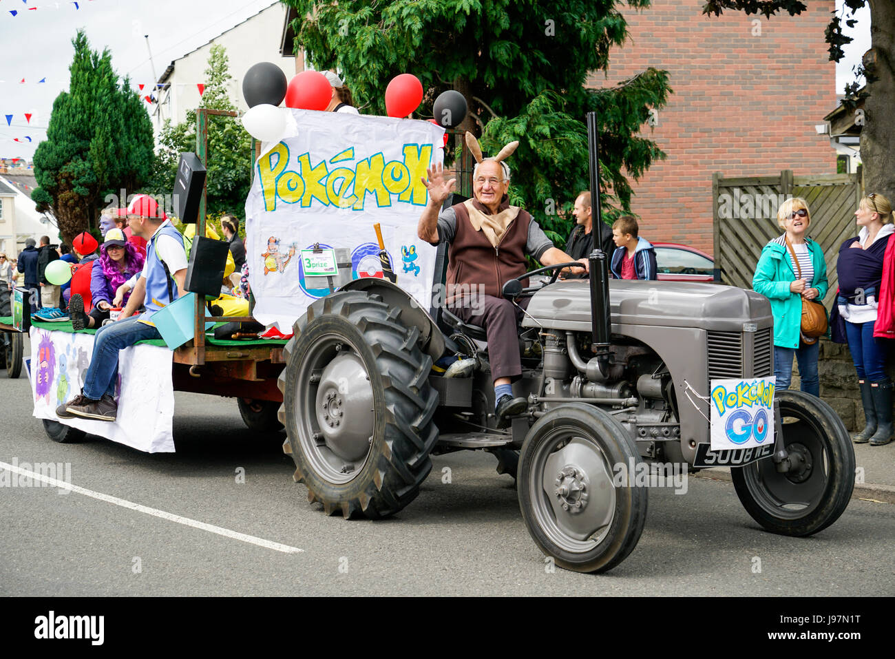 Tractor Ride Carnival Man driving old tractor Barlow annual Carnival procession Derbyshire ...