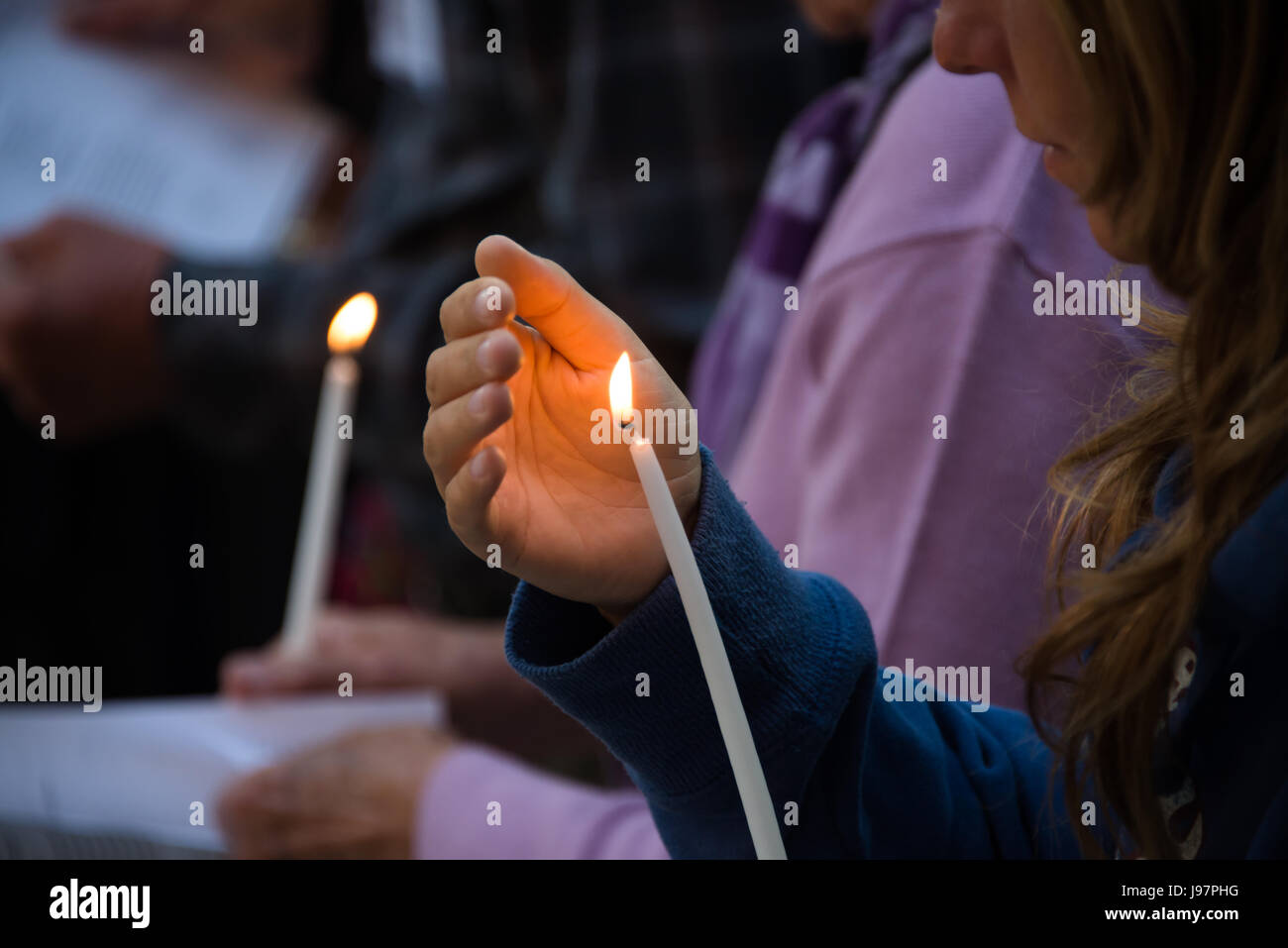Palestinian and international Christians gather at the Russian Orthodox Church of Mary Magdalene in the Garden of Gethsemane on the Mount of Olives for a candlelight Maundy Thursday prayer service, April 17, 2014. Stock Photo