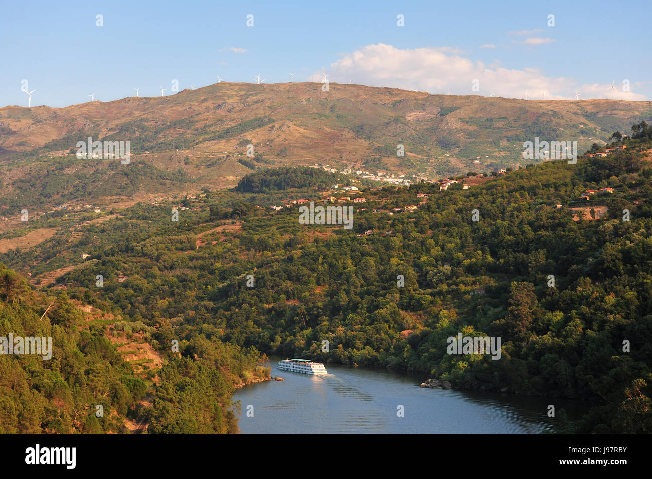 The Douro river and a hotel-ship near Resende and Montemuro mountains, Portugal Stock Photo